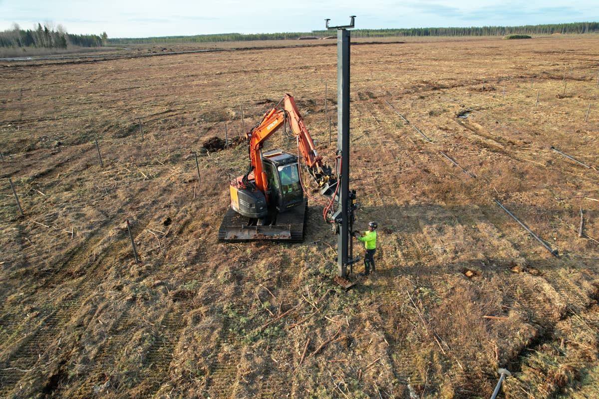 Drone overhead view of helical pile installation in progress at Hallanvahti