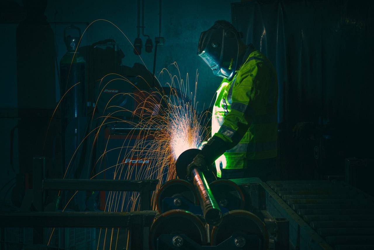 Welder finishing a helical pile at Paalupiste's EN 1090 Exc2 facility